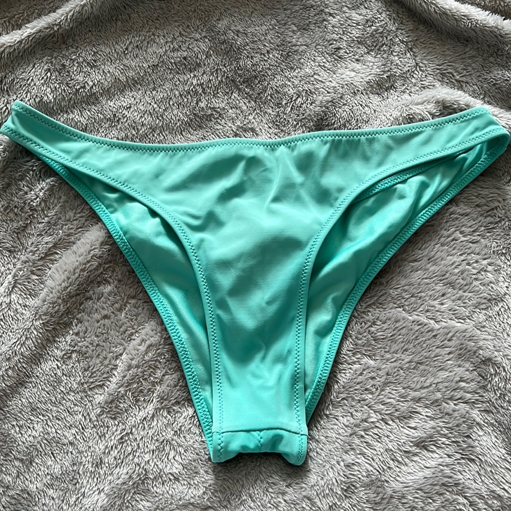 Teal cheeky bikini bottoms.